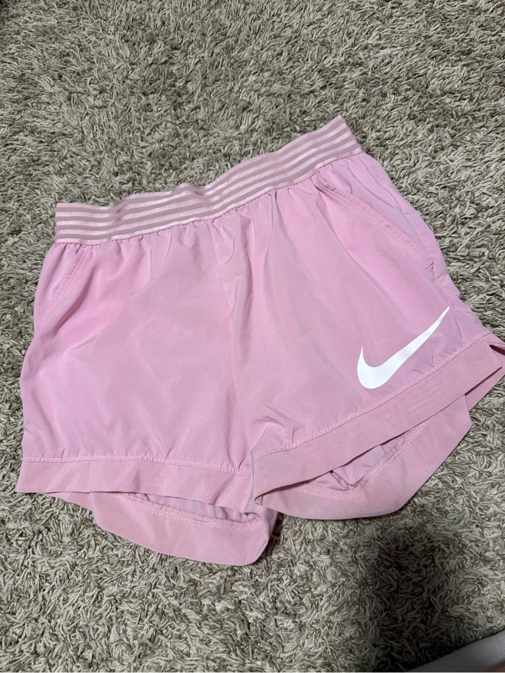 Nike Women’s Light Pink Athletic Shorts with White Swoosh